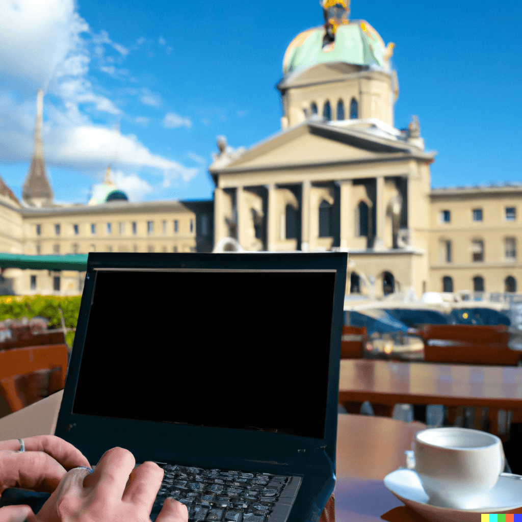 Mensch arbeitet mit Laptop mit Blick auf Gebäude in Bern